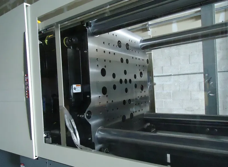 Platen and tie bars on the Nissei press, showing mold mounting pattern
